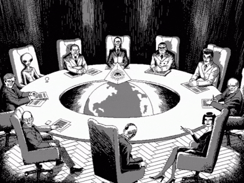 a group of people are sitting around a round table