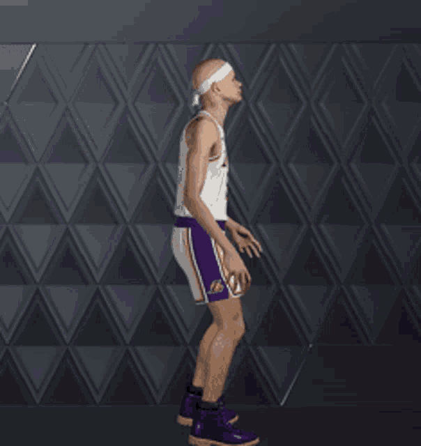 a man wearing a lakers jersey and purple shorts is bending down
