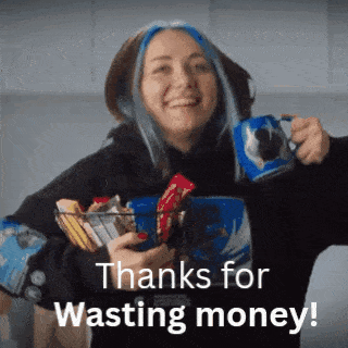 a woman with blue hair is holding a mug and a basket of snacks and says thanks for wasting money !