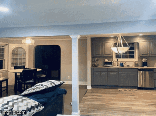 a picture of a living room and kitchen with the words imgflip.com in the lower right corner