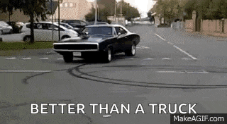 a dodge charger is driving down a street with the words `` better than a truck '' below it .