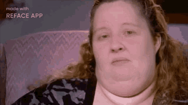 a very fat woman is sitting in a chair with a very thick neck .