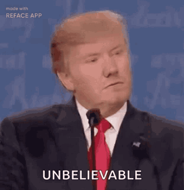 a man in a suit and tie is giving a speech at a podium .