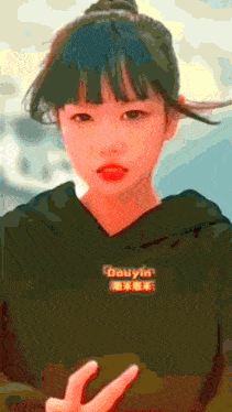 a girl wearing a black hoodie that says douyin