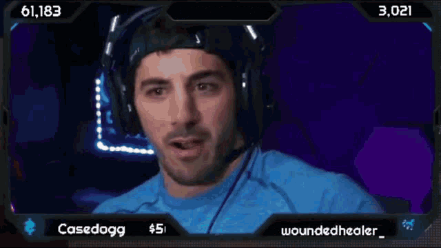 a man wearing headphones is on a screen that says nickmercs and casedogg
