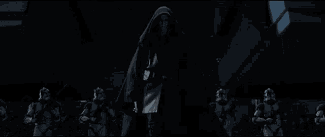 a group of storm trooper soldiers are standing in a dark room .