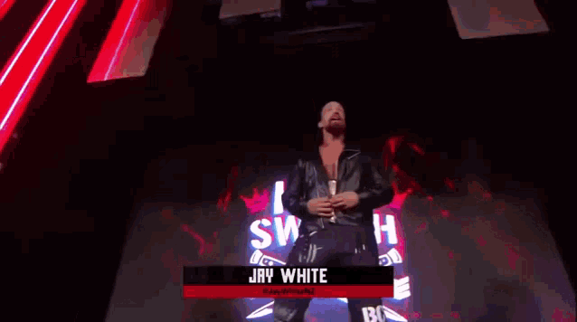 a wrestler named jay white is on a stage