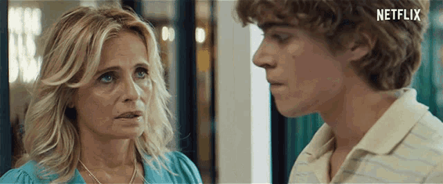 a woman and a boy are looking at each other with netflix written on the bottom