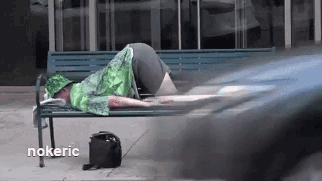 a person laying on a bench with the word nokeric on the bottom left