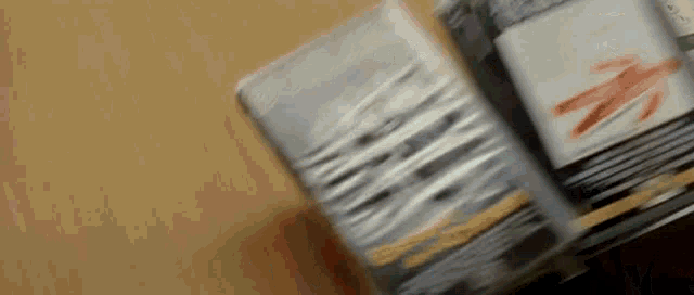 a close up of a book being opened on a table .
