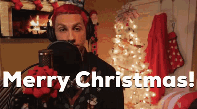 a man with red hair singing merry christmas
