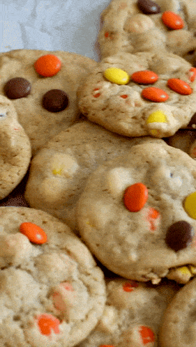 a stack of cookies with peanut butter and chocolate chips on top