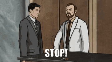 two men in suits and ties are standing next to each other and one of them is saying stop .