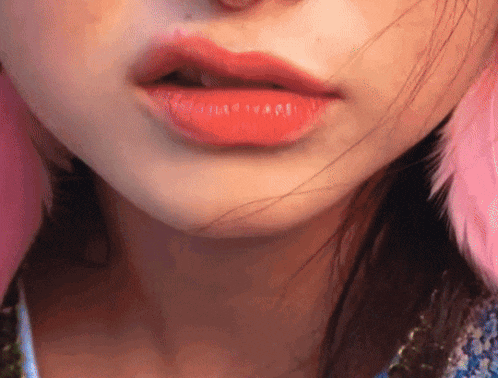 a close up of a woman 's lips with red lipstick on