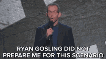 ryan gosling did not prepare me for this scenario while holding a microphone in front of a crowd .