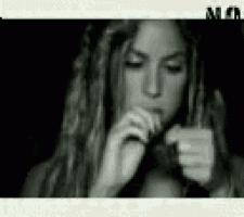 a black and white photo of a woman with the word mc on the bottom right