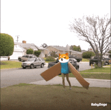 a picture of a dog wearing a blue sweater and a cardboard wing