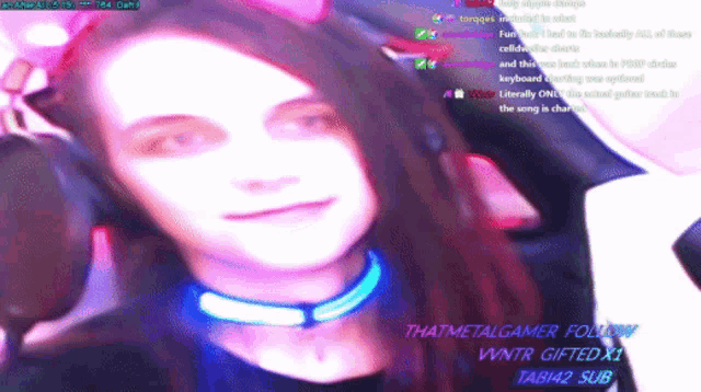 a woman 's face is shown in a blurry photo with the words thatmetalgamer follow on the bottom right