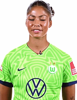 a woman wearing a green shirt with a vw logo on it