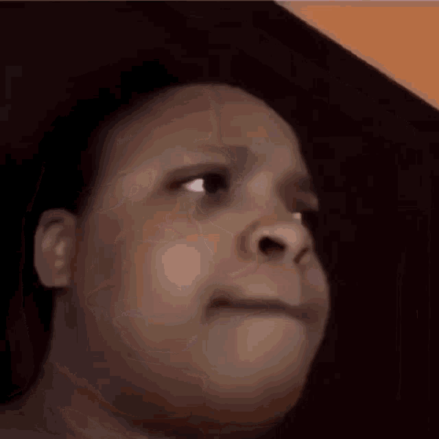 a close up of a person making a funny face .