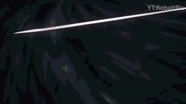 a close up of a sword on a black background with the words yt : kobaltblu on the bottom