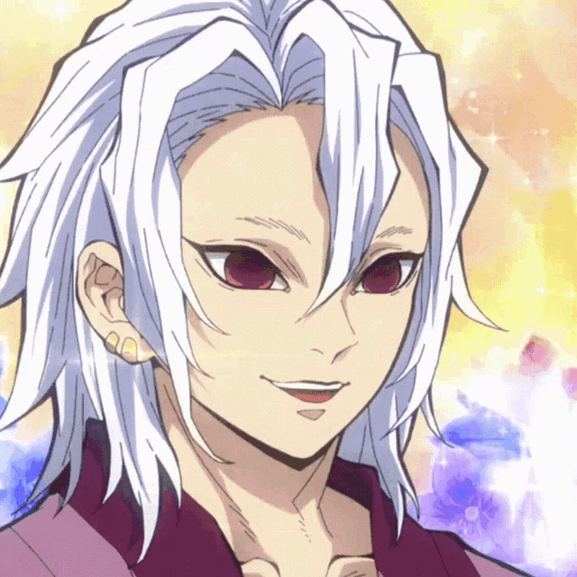 a man with white hair and red eyes is smiling