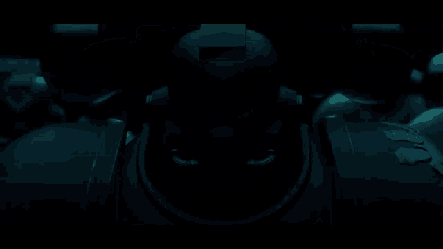 a blurred image of a robot with a red light coming out of it