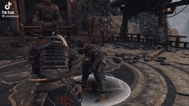 a man is fighting another man in a video game with a sword and a fireball .