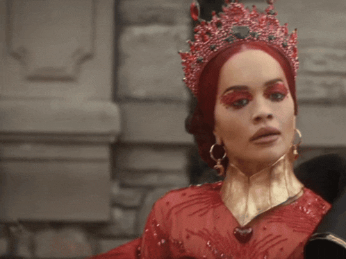 a woman wearing a red dress and a crown