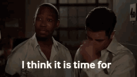 two men are standing next to each other and one of them says me to start a puzzle .