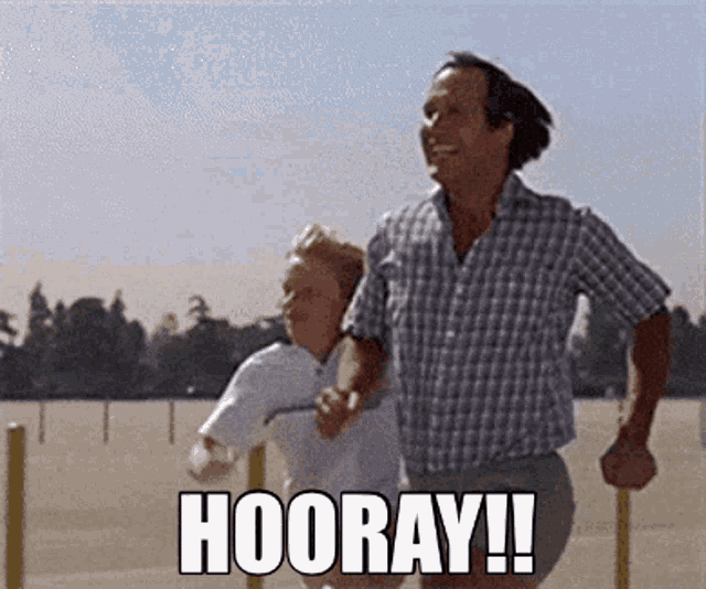 a man and a boy are running and the words hooray are on the ground