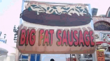 a sign for big fat sausage with a picture of a hot dog on it