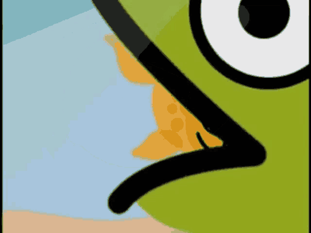 a close up of a cartoon character 's face with a yellow object in its mouth