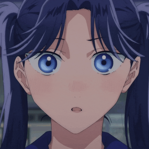 a girl with blue eyes and pigtails makes a funny face