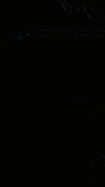 a close up of a car windshield with a red light
