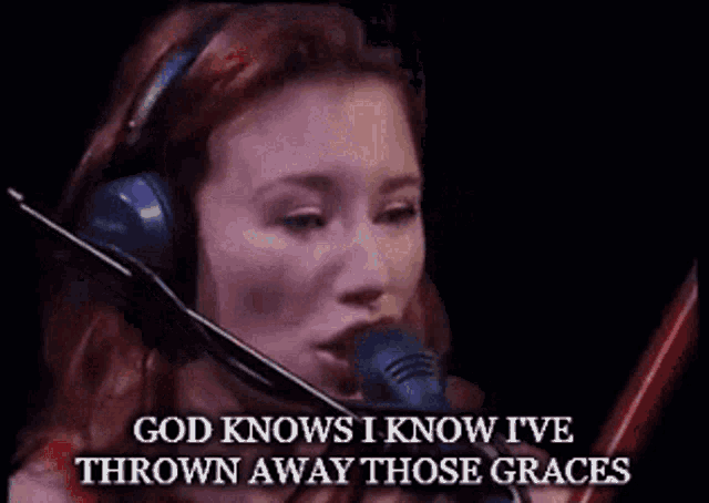 a woman wearing headphones singing into a microphone with the words god knows i know