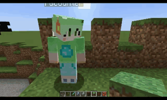 a person in a green shirt with a blue s on it