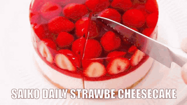 a cheesecake with strawberries on it and the words saiko daily strawbe cheesecake