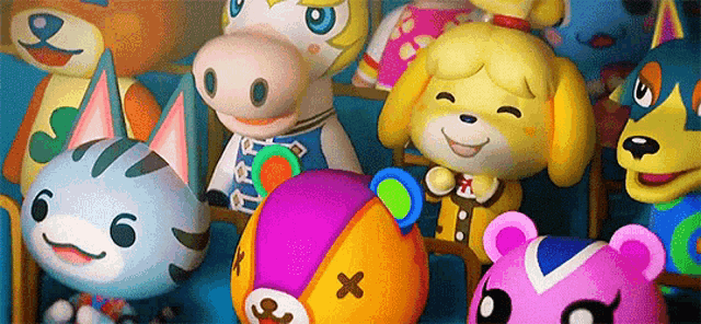 a bunch of stuffed animals are sitting next to each other and smiling .