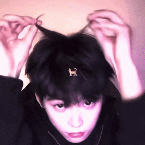 a person with a cat earring on their head