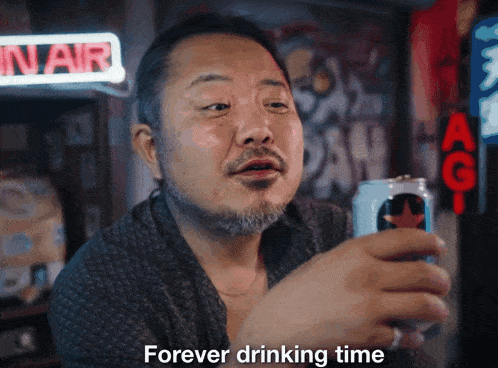 a man with a beard holds a can of beer and says " forever drinking time "