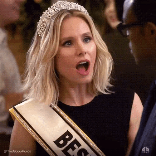 a woman wearing a tiara and a sash with the word best on it is making a funny face .