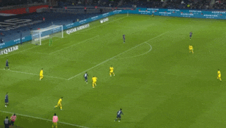 soccer players on a field with qatar airways advertisements