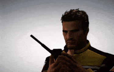 a man in a yellow jacket holds a gun