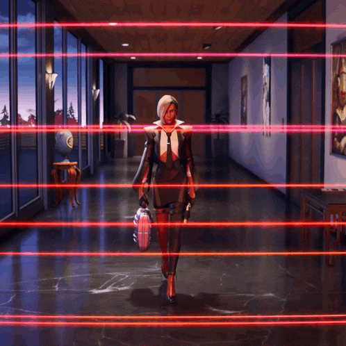 a woman in a suit and tie is walking down a hallway