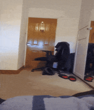 a room with a chair and a door that says ' i ' on it