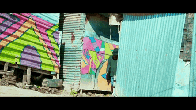 a building with graffiti on it that says ' slum ' on it