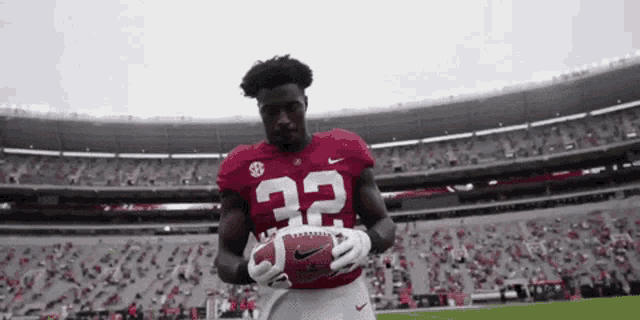 a football player wearing a red jersey with the number 22 on it