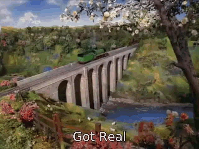 a train is going over a bridge with the words got real written below it