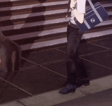 a man petting a dog with a school bag that has a circle on it